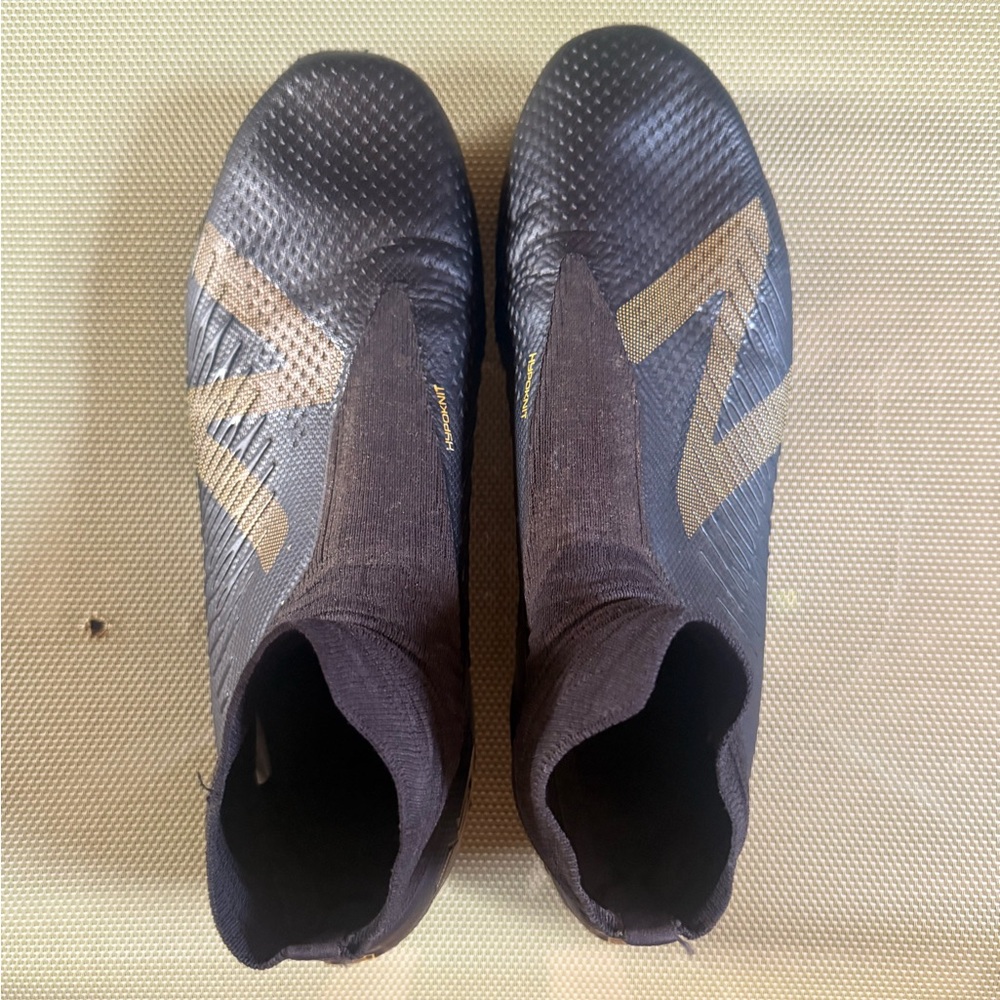 New Balance Black and Gold Athletic Shoes